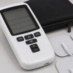 TE-TEN-001 TENS/EMS device in use with electrode pads applied
